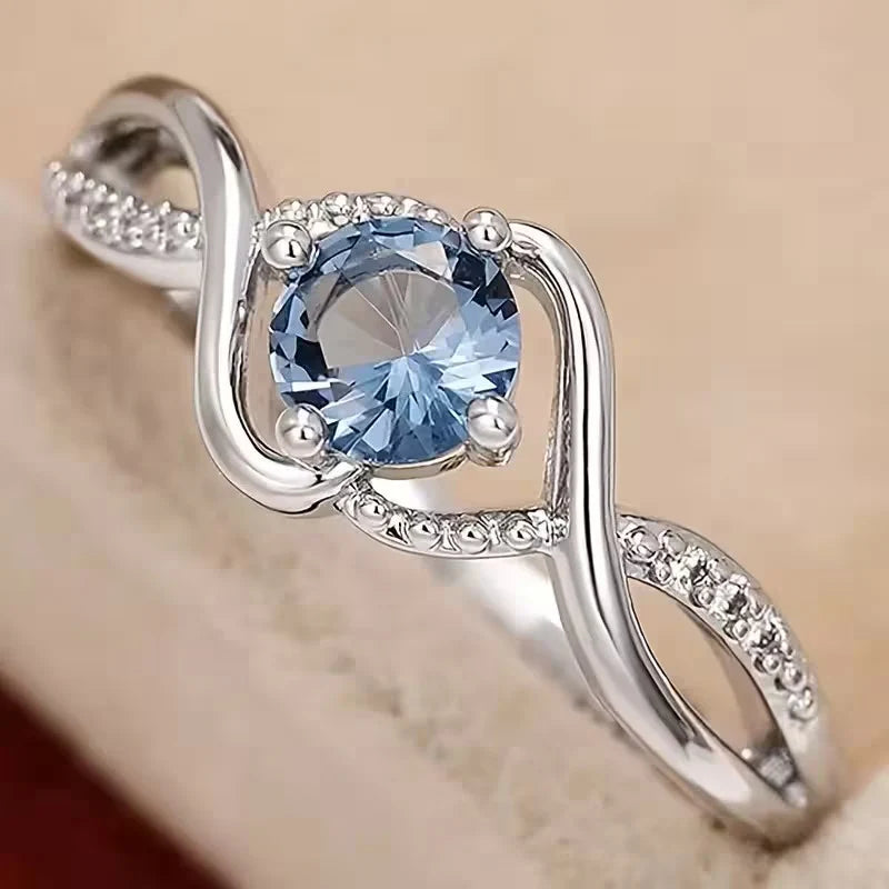 A Minimalist Wave-shaped Blue Synthetic Zirconia Ladies' Ring For Parties, Dances, Daily Wear, And Jewelry Gifts.