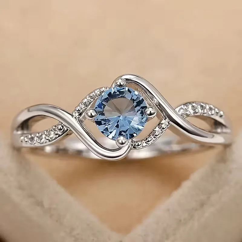 A Minimalist Wave-shaped Blue Synthetic Zirconia Ladies' Ring For Parties, Dances, Daily Wear, And Jewelry Gifts.