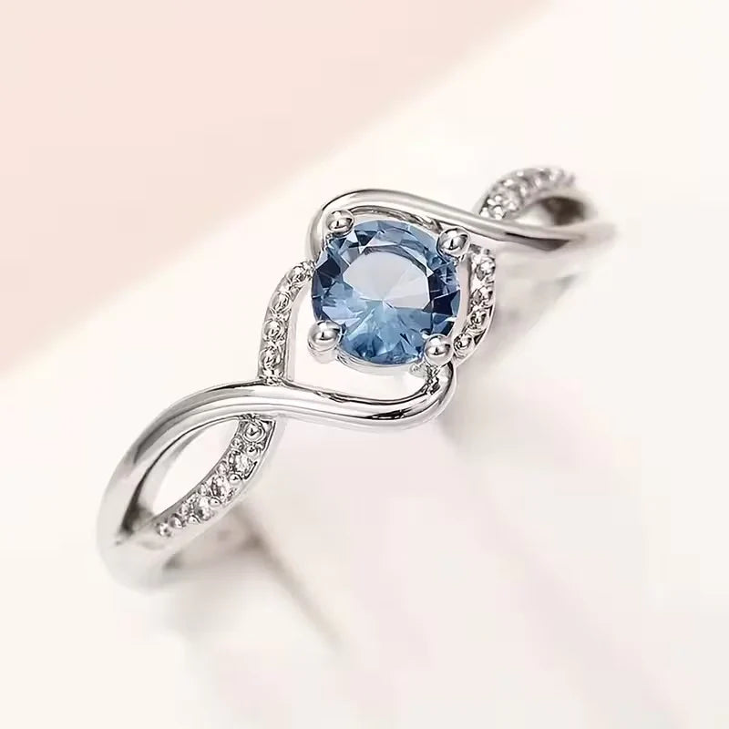 A Minimalist Wave-shaped Blue Synthetic Zirconia Ladies' Ring For Parties, Dances, Daily Wear, And Jewelry Gifts.